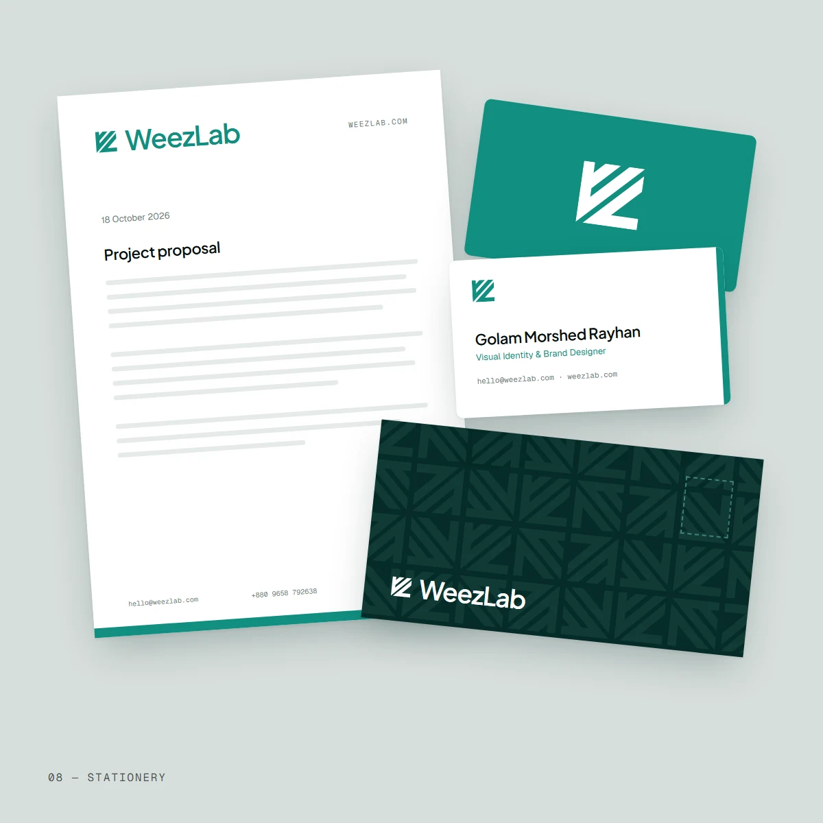WeezLab stationery: a letterhead with a teal footer rule, a patterned deep teal envelope and two business cards.